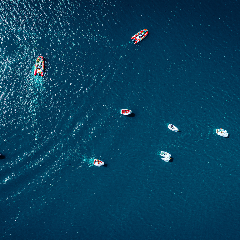 Top view of regatta of small boats on the lake
